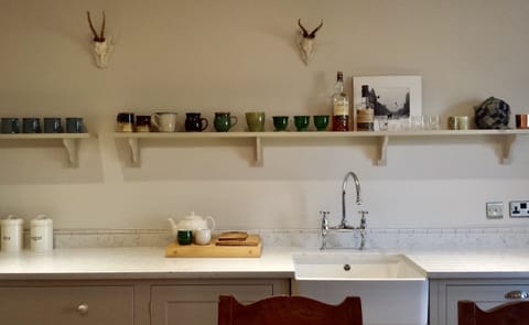 Kitchen designed by DeVol Kitchen makers. Communal, farmhouse table and views.