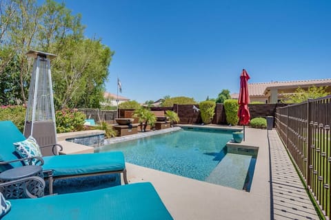Spacious heated private pool with sun loungers, perfect for relaxing or entertaining outdoors.