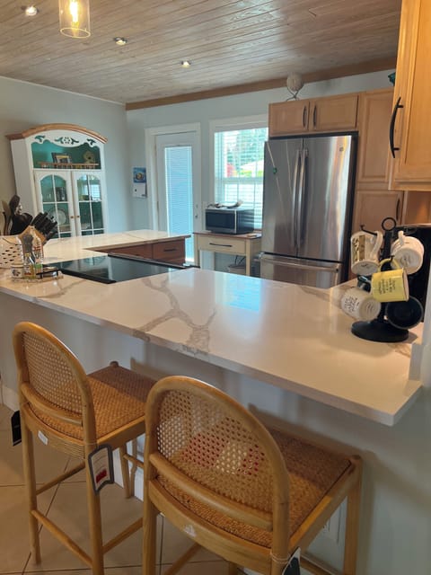 Open kitchen with solid surface countertops 