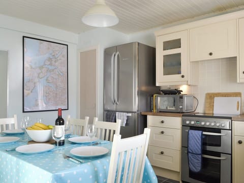 Fully equipped kitchen with dining area | Shore Cottage, Arnisdale, near Glenelg