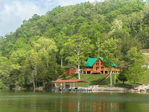 View of the cabin nestled in the trees! (prior to addition of deck roof)