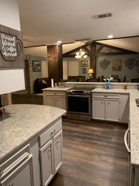 The kitchen with new open concept layout looking into living/dining room