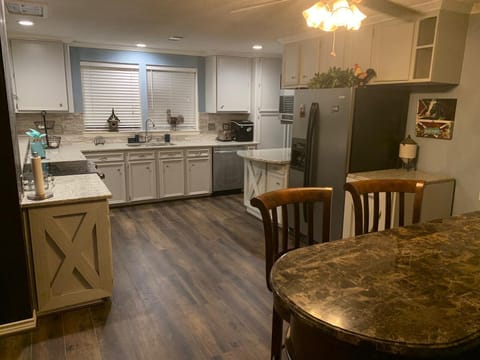 Additional seating options at a traditional bar area close to the kitchen 