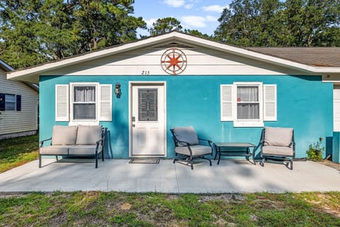 Front of home with patio area and comfortable seating