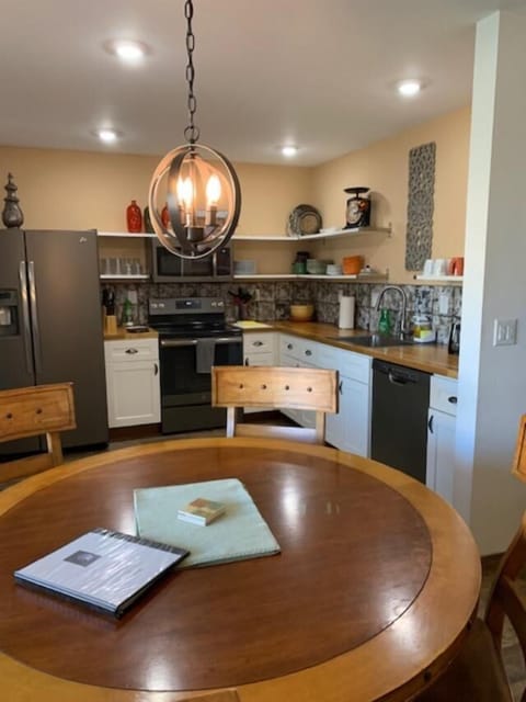 Looking from dining table toward kitchen.