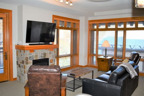 Open living room in corner unit with lots of natural light