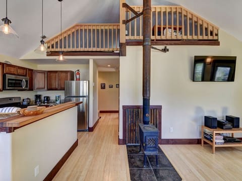 Looking up at loft from living room