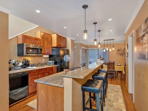 Kitchen island with granite breakfast bar and 3 bar stools, with new lighting