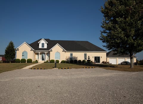 Front of house with private parking area