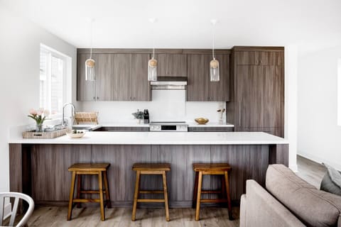 first floor -kitchen, breakfast counter, stove, refrigerator, microwave, dishwasher. Washer and dryer just around the corner  from the kitchen to the right of the picture. Lots of storage in the kitchen space.