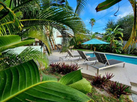 Rest and relaxation in your own eden of Cocoa Beach! Heated pool, rooftop deck!