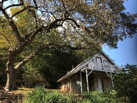 Cabin 1 includes a private patio and private upstairs balcony.