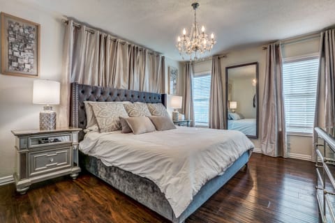 beautiful large master with luxury linens. 