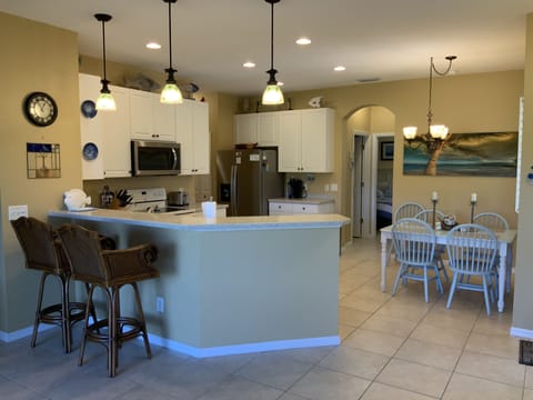 Open floor plan with breakfast bar to watch the chef