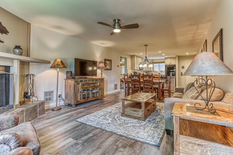 The TV in this photo has been replaced with a new 65 inch Smart TV 