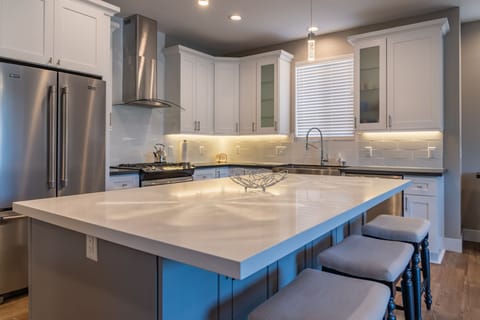 Open Kitchen with Stainless Steel Appliances and an Island
