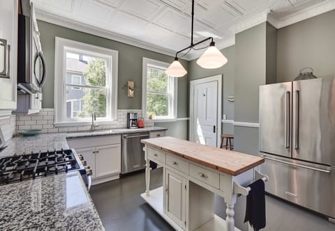 Kitchen with granite countertops and stainless steel appliances.