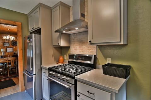 Stainless Steal appliances give the kitchen a sleek modern element that blends perfectly with the natural wood accents.