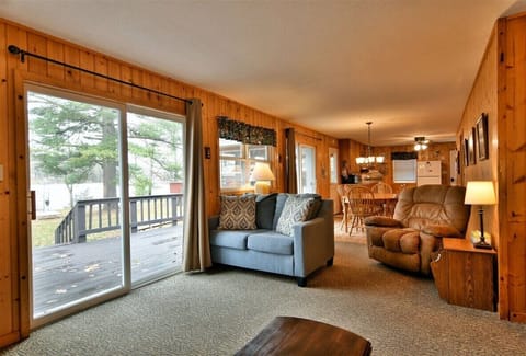 Living Area, Dining and Kitchen face windows to the lake.