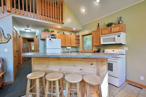 Down the hall you'll find 2 bedrooms with queen beds, bathroom and door to lower level.