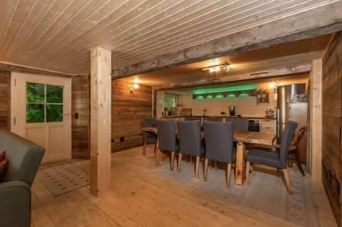 ground floor living room dinning table near open kitchen 