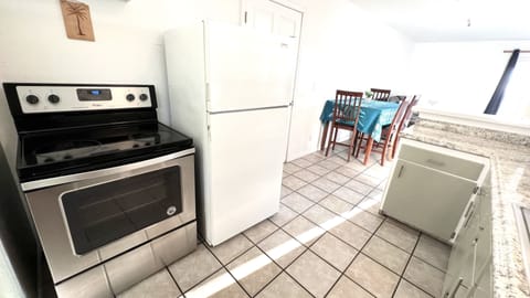 Full kitchen with oven and full size fridge
