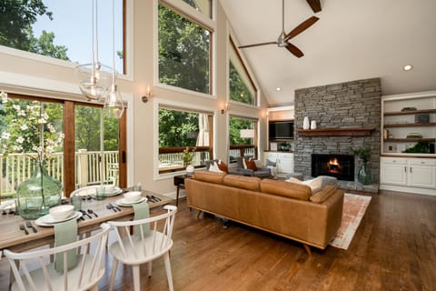 Open plan living/dining area with gas fireplace and fabulous views.