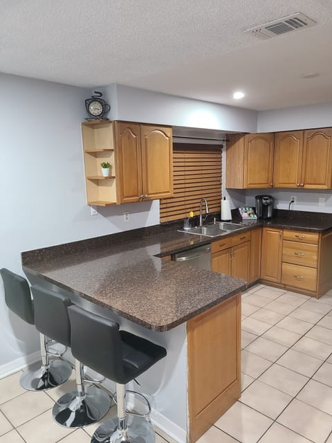 Shown is the spacious kitchen with counter seating for three