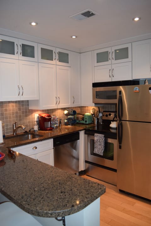 Updated kitchen with granite countertops. 