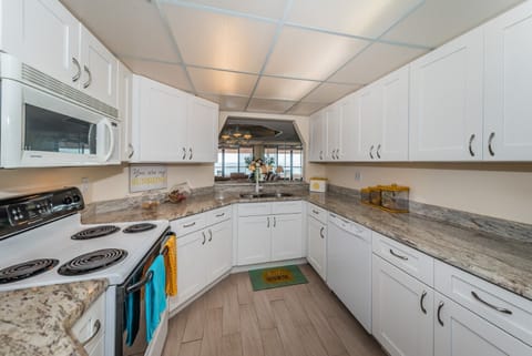 New kitchen also looks out  to the Gulf.  Prepare meals watching boats sail by.