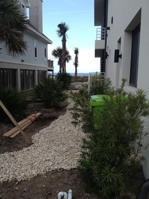 Side walkway with outdoor shower (not in picture)