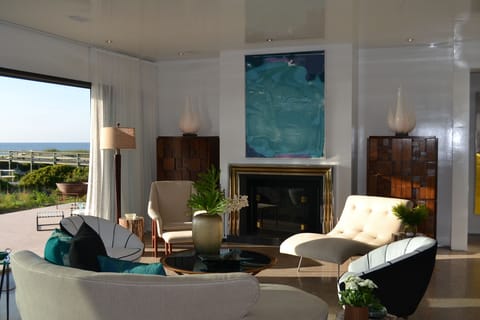 View of living room with wood burning fireplace