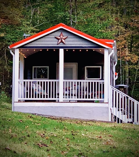 Sit on the porch on porch furniture under soft party lighting.