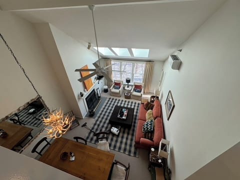 View of main floor living space from 2nd floor loft