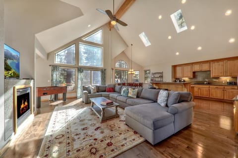 Cozy up by the gas fireplace, watch a movie on the large flat screen, or play a game of foosball all in this open-concept living room