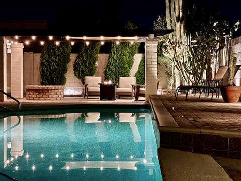 Backyard with 50ft long pool and patio with wood fire pit