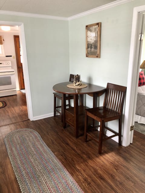 Dining area. Two more bar stools are against the other wall (table seats 4)
