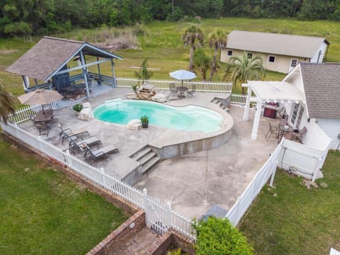 POOL AREA WITH POOL HOUSE AND PAVILION WITH LARG SCREEN TV