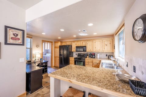 Warm and Inviting Kitchen with a Spacious Breakfast Bar w Seating for 2, Full Size Appliances Including Oven, French Door Fridge, Granite Counter Tops