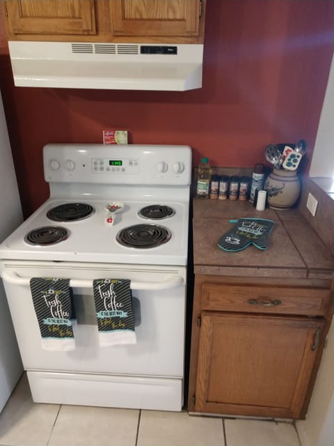Stove fully equipped with cooking items pots and pans