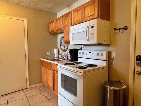 Full Kitchen with stove, microwave, Keurig, refrigerator 