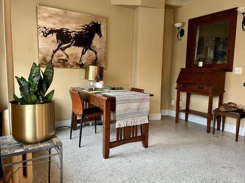 Dinning nook for two and desk on the right that folds out for use. 
