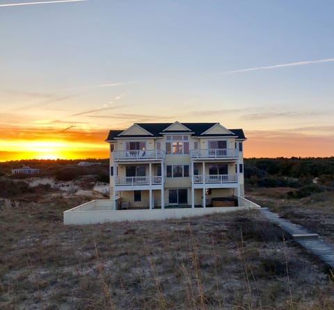 Sunsetting behind Away From It All..photo taken while at the ocean facing home