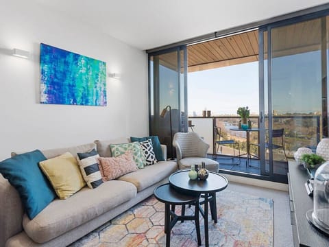 Comfortable lounge area opening up onto a balcony with amazing views