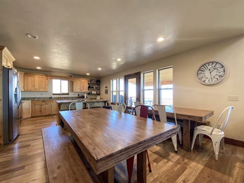 Spacious dining area with rustic wood tables, perfect for gatherings and meals with a view