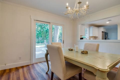 Dining area slider leads out to large backyard.