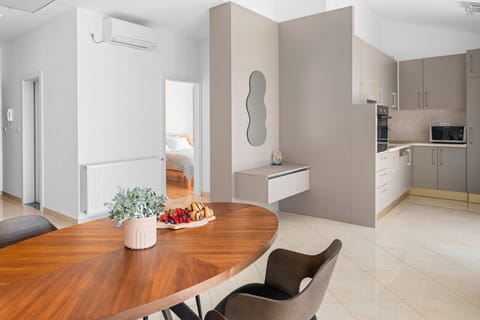 Fully equipped kitchen with dining table and direct exit to the terrace with amazing sea view