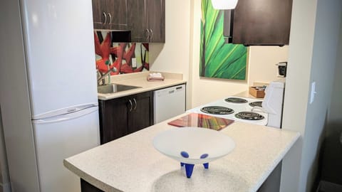 Kitchen - Eurostyle fridge, Dishwasher, oven and cooktop. Lots of utensils too.