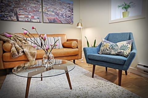 Living area with leather sofa and a mid-century modern vibe.