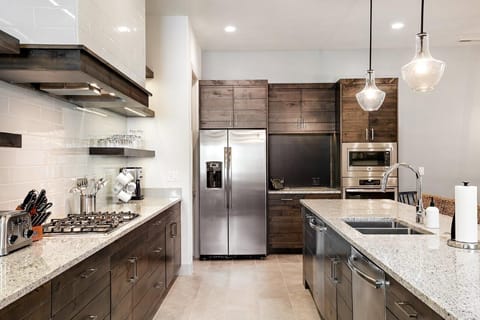 Kitchen is stocked with appliances and utensils to make mealtime a breeze